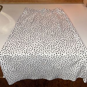 Black and white polka dot skirt. Worn once!!! Elastic around the waist band.